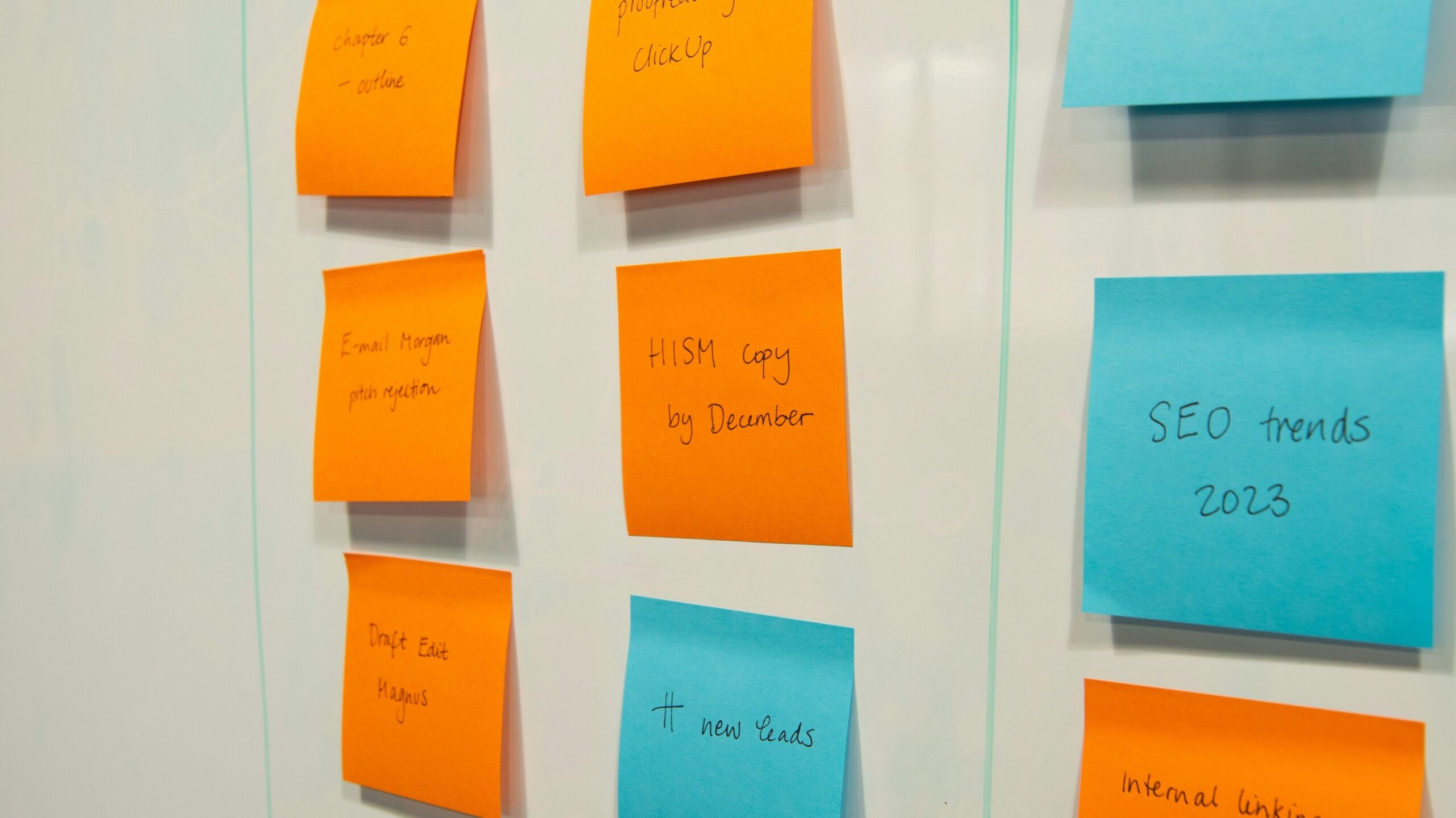 Stock photo of sticky notes on a whiteboard.